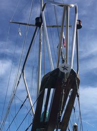 Low angle view of sailboat on sea against sky