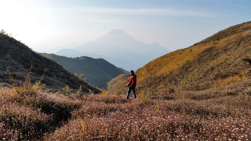 Man on mountain against sky