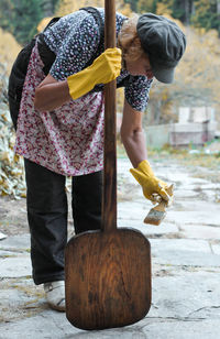 Woman painting on wood