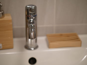 Close-up of glasses on table at home