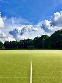 Scenic view of soccer field against sky