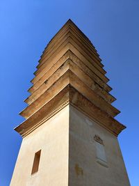 Low angle view of building against clear blue sky