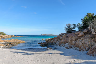 Scenic view of sea against blue sky