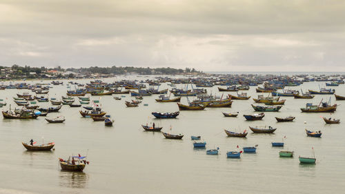 High angle view of harbor by sea against sky