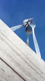 Low angle view of built structure against blue sky