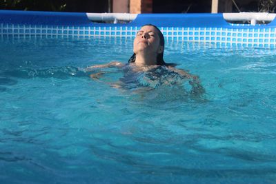 Woman swimming in pool