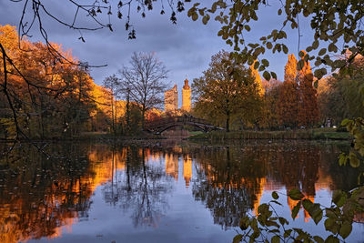 Reflection of trees in lake against sky during autumn