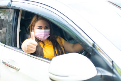 Portrait of a woman in car