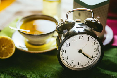 Close-up of clock on table