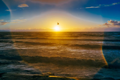 Scenic view of sea against sky during sunset