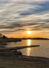 Scenic view of sunset over lake