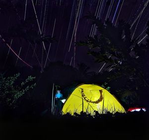 Illuminated tent at night