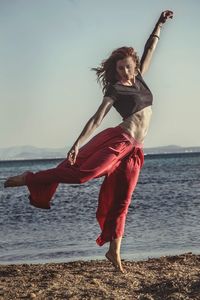 Woman standing on beach