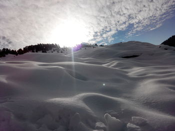 Scenic view of snow covered mountains against sky