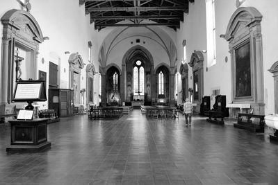 Panoramic view of empty corridor of building