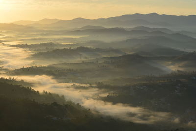 High angle view of mountains against sky during sunset