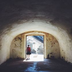 Woman walking in corridor