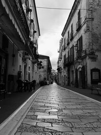 Narrow street amidst buildings in old town