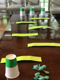 Close-up of multi colored bottles on table