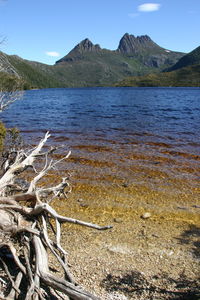 Scenic view of lake and mountains against sky