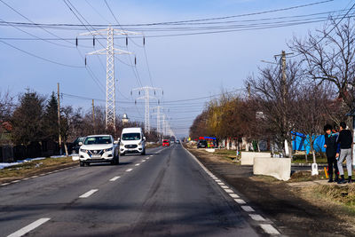 Cars on road against sky