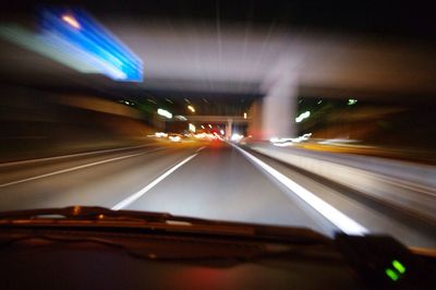 Car moving on road at night