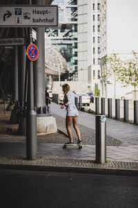 Full length of a woman on road