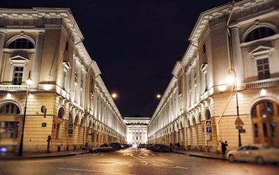 Cars on road in city at night