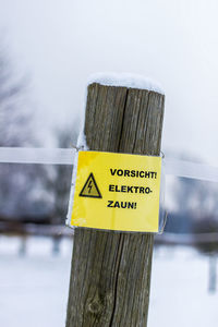 Close-up of yellow text on wood