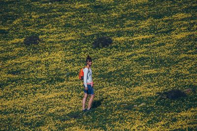 Full length of woman walking on field