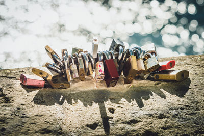 Close-up of padlocks on metal field