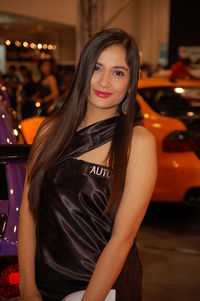 Portrait of smiling young woman standing outdoors