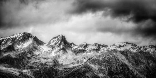 Idyllic shot of snowcapped mountains against sky