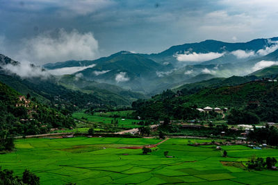 Scenic view of landscape and mountains against sky