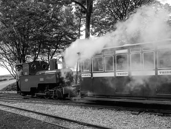 Train on railroad track against sky