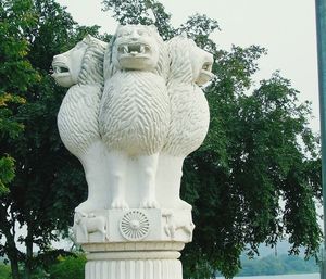 Low angle view of statue against sky