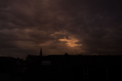 Silhouette of city at sunset