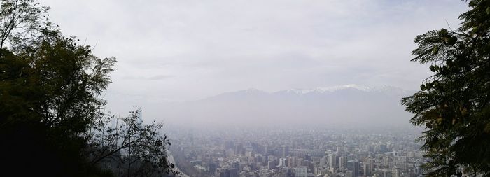 Scenic view of mountains against cloudy sky