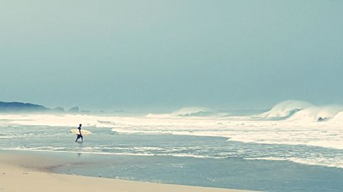 Scenic view of beach against sky