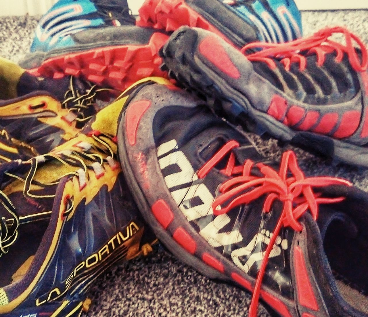 close-up, no people, shoe, indoors, shoelace, still life, day, textile, multi colored, high angle view, selective focus, focus on foreground, red, art and craft, pattern, creativity, leather