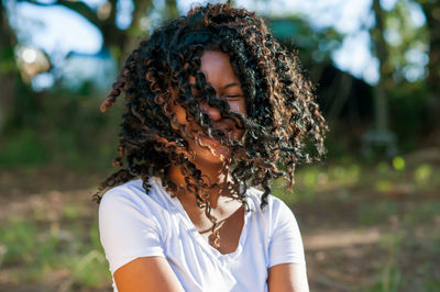 Portrait of smiling girl sitting at park