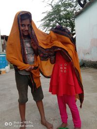 Rear view of women standing on street