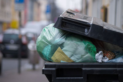 Close-up of plastic bag in garbage bin