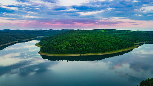 Scenic view of lake against sky during sunset