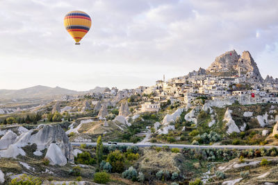 Hot air balloons flying against sky