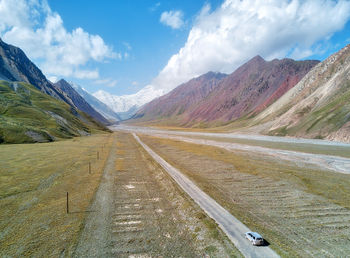 Road amidst landscape against sky