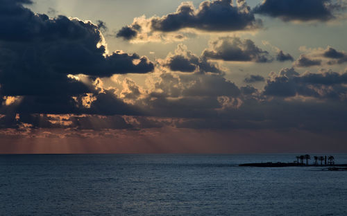 Scenic view of sea against cloudy sky