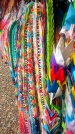 Close-up of multi colored flags on fabric