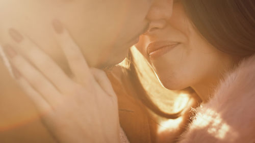 Romantic couple look each other at sunset light