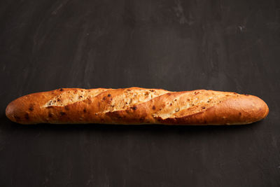 Close-up of bread against black background
